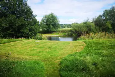 Couples pitch closer to the river in the area named Dragonfly Walk