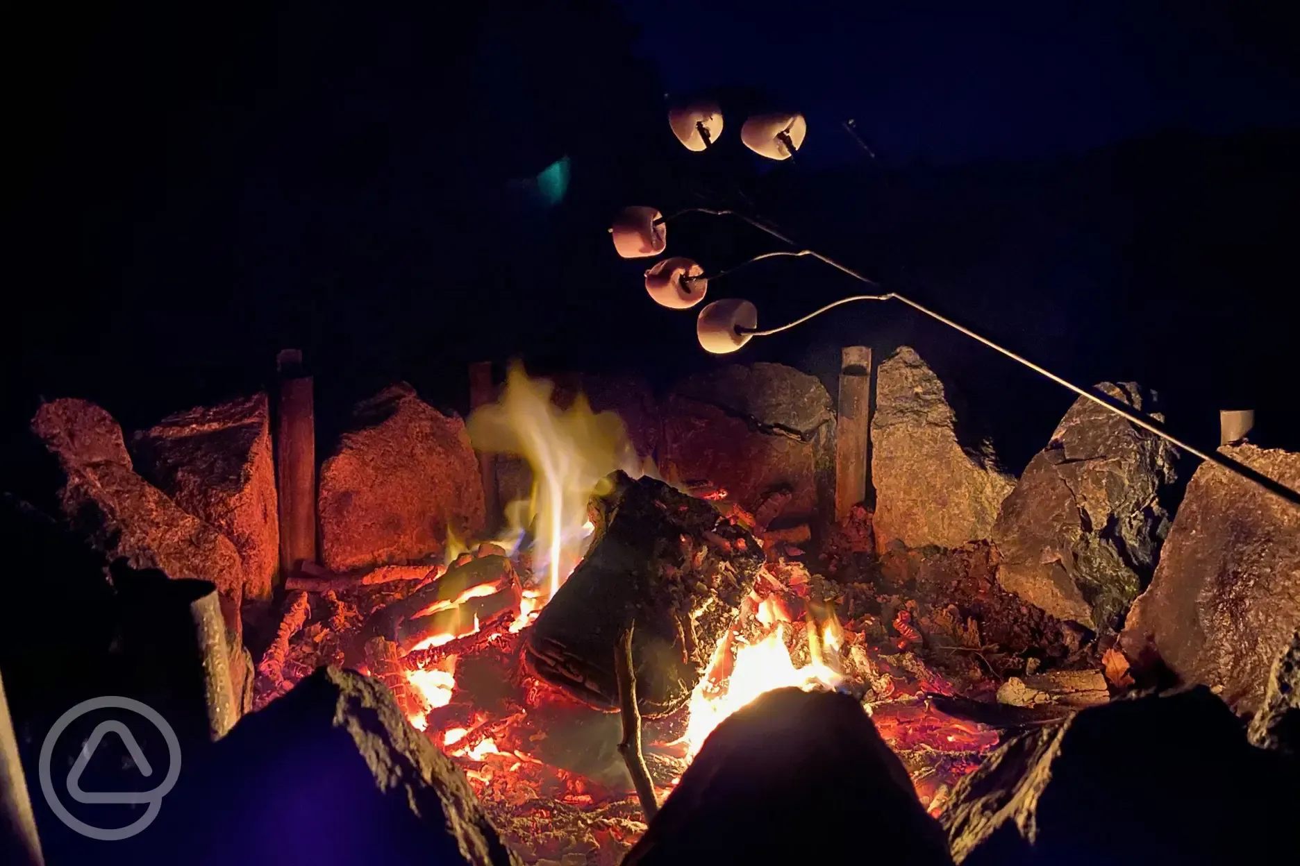 Communal fire pit at night