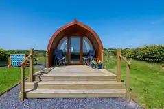 Ensuite glamping pod exterior with private decking Ensuite glamping pod exterior with private decking
