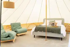 Woodland bell tents with a king size bed and two single futons