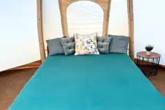 Airdome ready tent interior with a king sized bed
