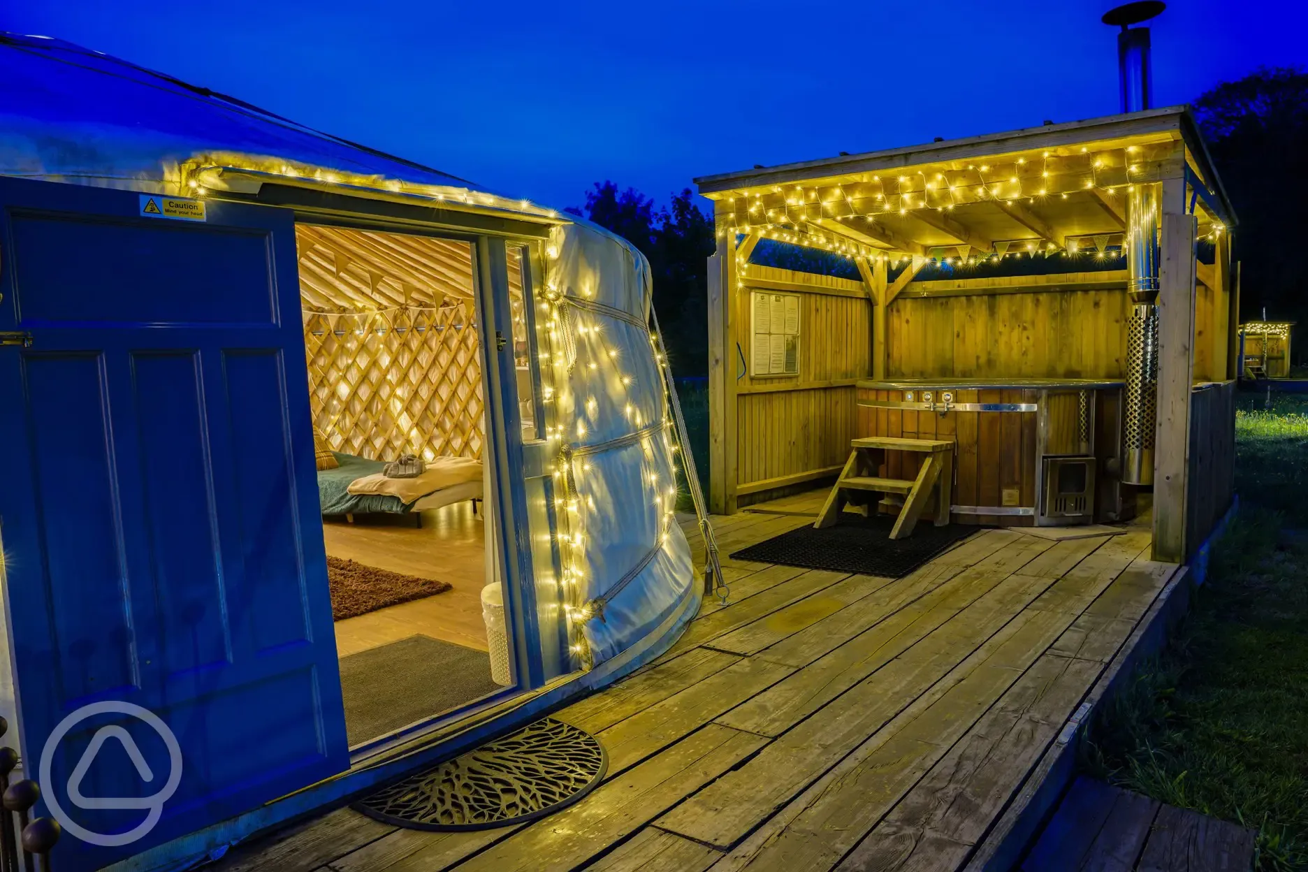 Luxury insulated yurt (sleeps 2-6) and hot tub at night