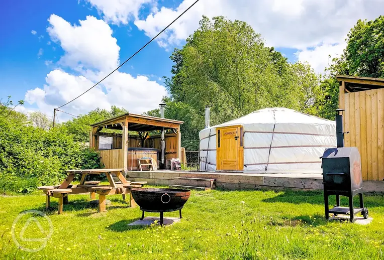 Yurt with a private hot tub, fire pit and covered kitchen at Glamp and Tipple