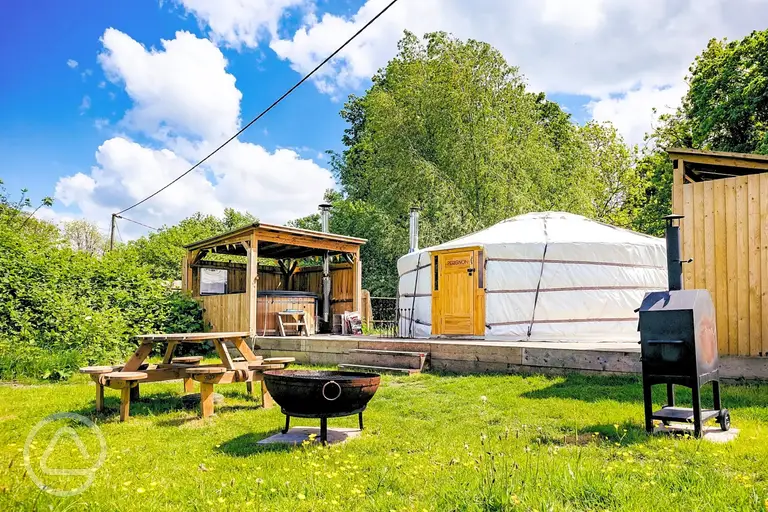Yurt with a private hot tub, fire pit and covered kitchen at Glamp and Tipple
