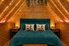 Cabin interior with double bed Cabin interior with double bed