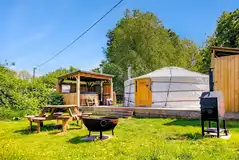 Yurt with a private hot tub, fire pit and covered kitchen at Glamp and Tipple