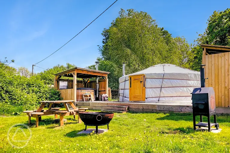 Yurt with a private hot tub, fire pit and covered kitchen at Glamp and Tipple