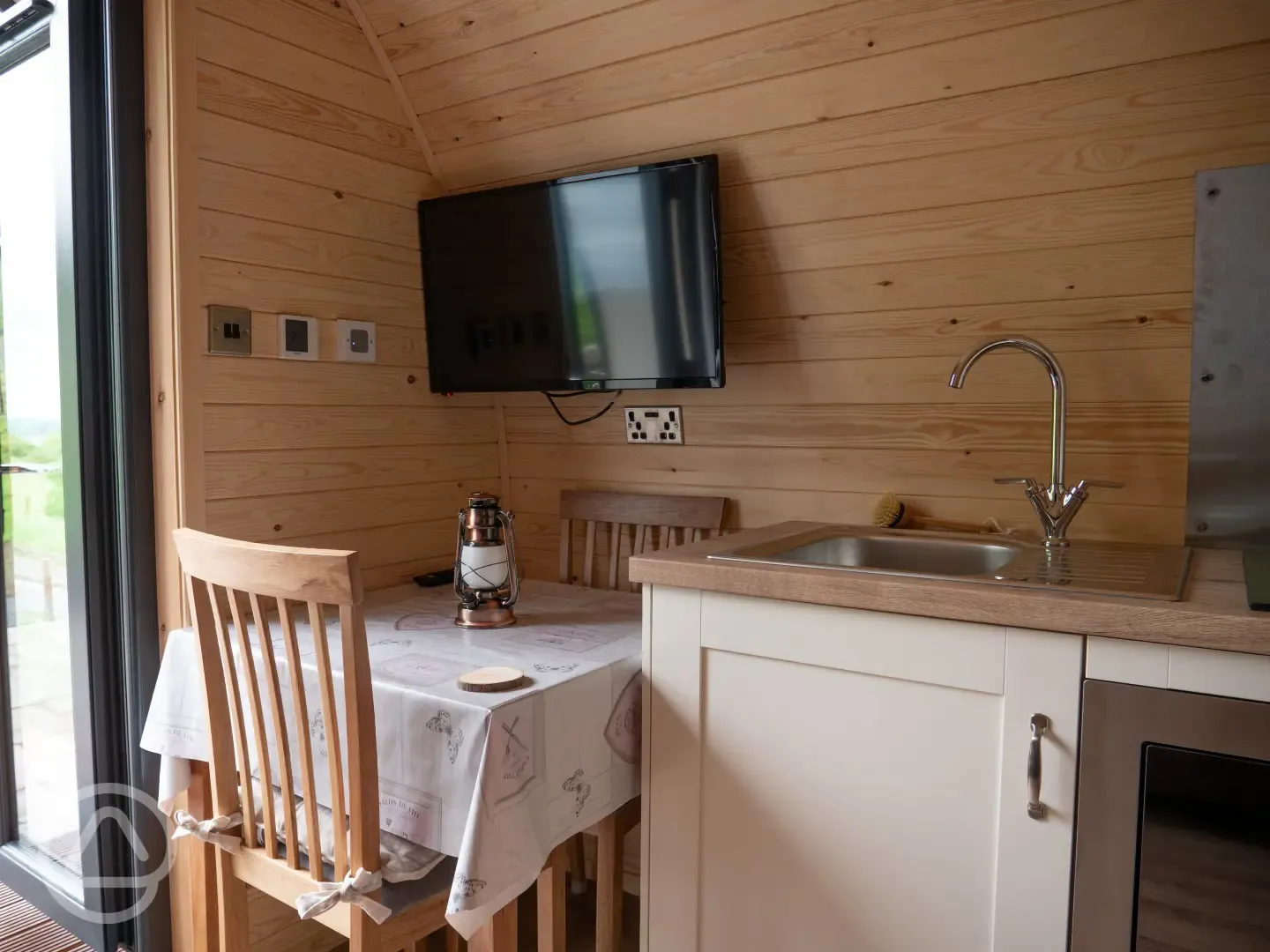 Glamping pod dining table and TV