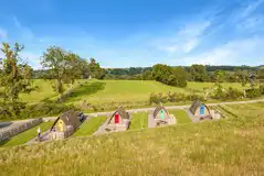 Camping pods that look over the meadow