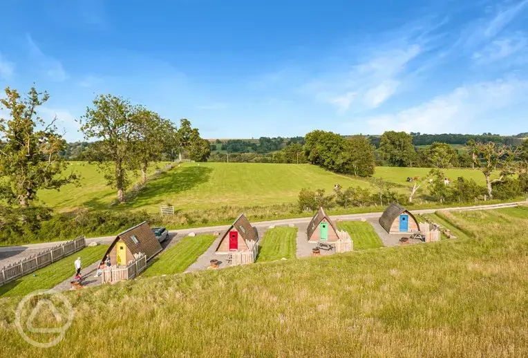 Camping pods that look over the meadow