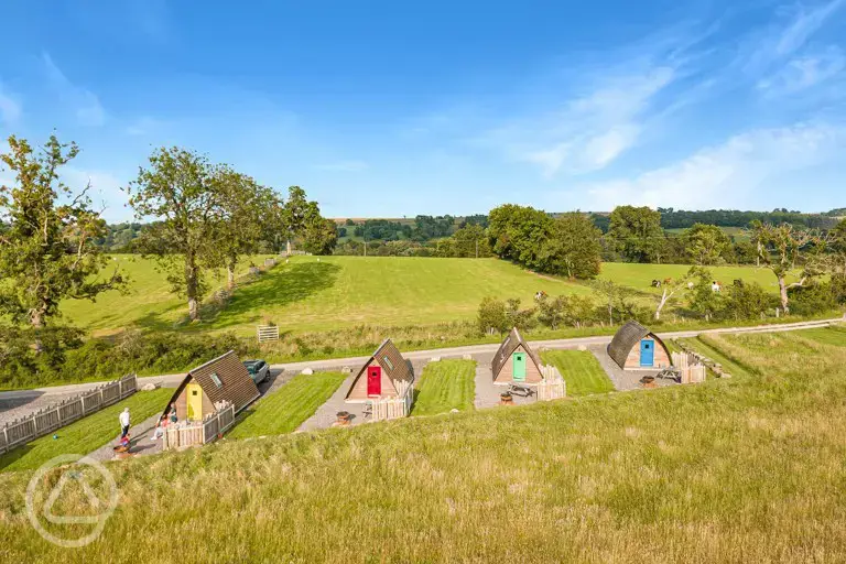 Camping pods that look over the meadow