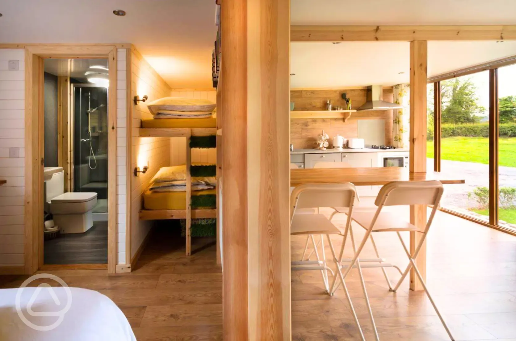 Blossom glamping pod - interior with bunk beds and ensuite bathroom