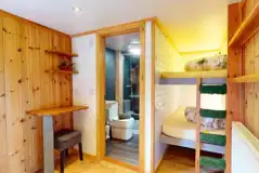 Blossom glamping pod - interior with bunk beds and ensuite bathroom