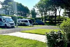 Fully serviced hardstanding pitches with 10 amp electric, water and grey waste