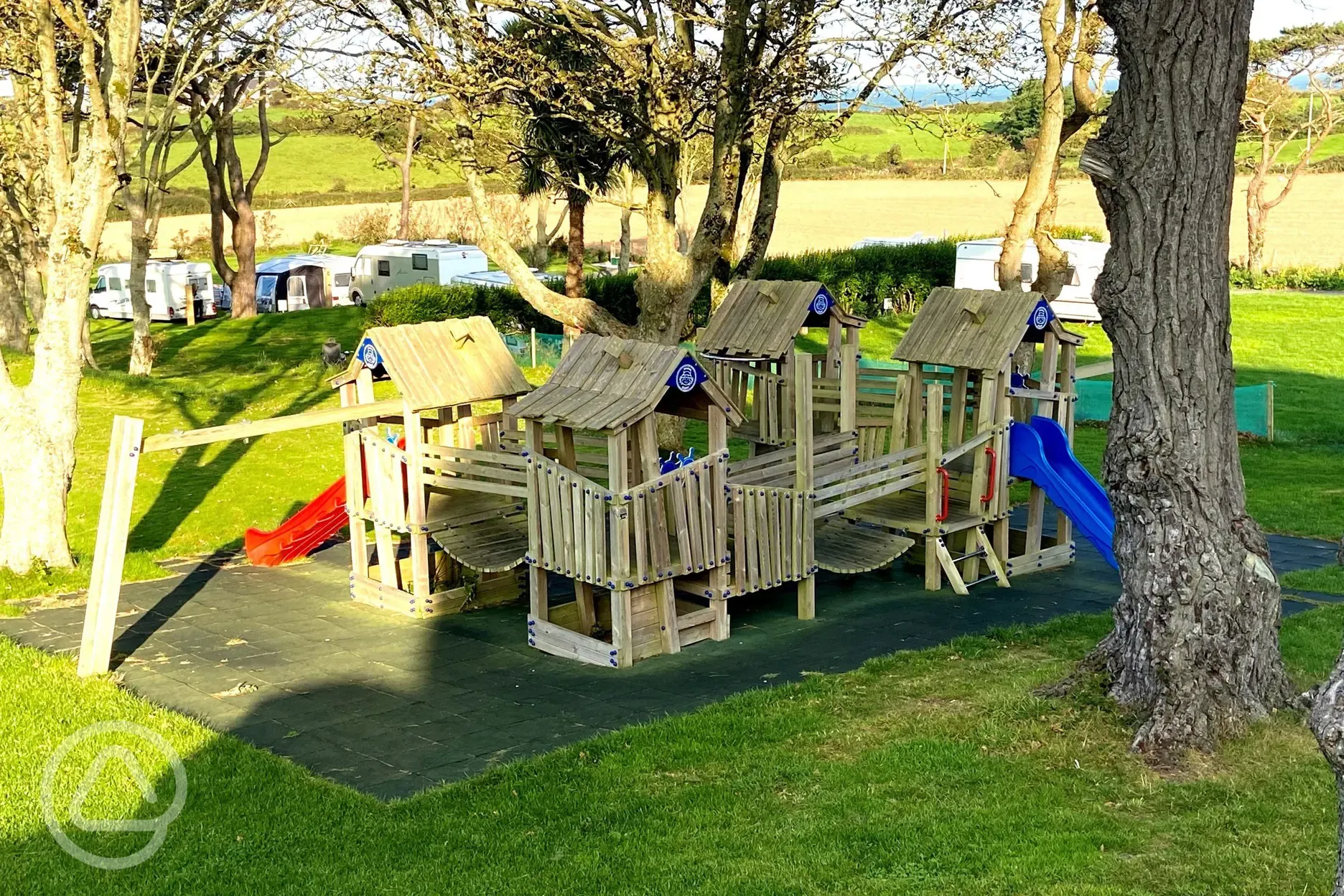 Children's play park with a climbing frame and slide