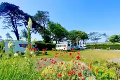 Fully serviced hardstanding pitches set amongst landscaped grounds