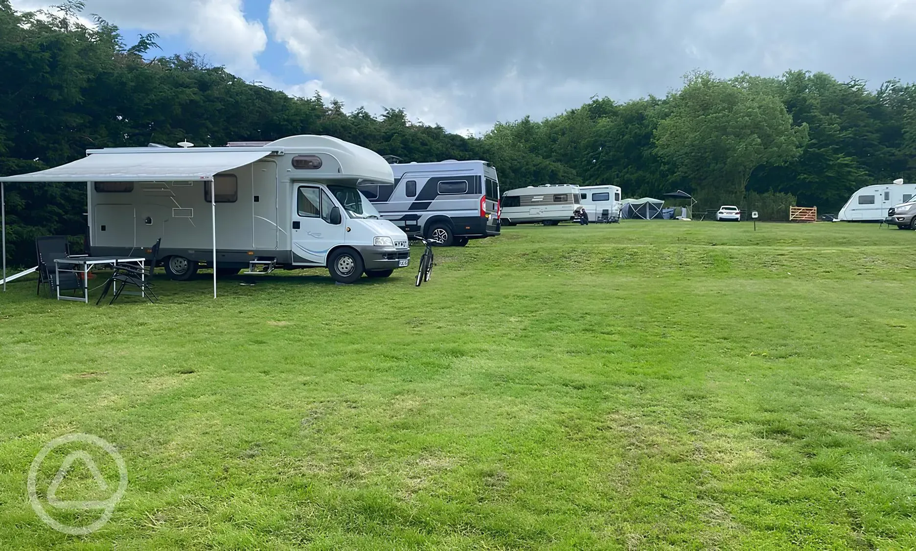Motorhome on grass pitch with an awning