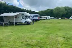 Motorhome on grass pitch with an awning