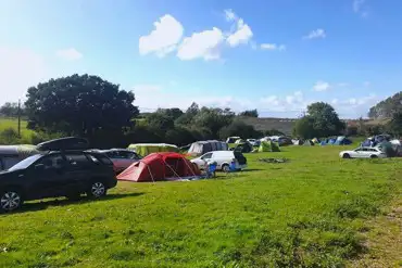 Tents on grass pitches with space for parking