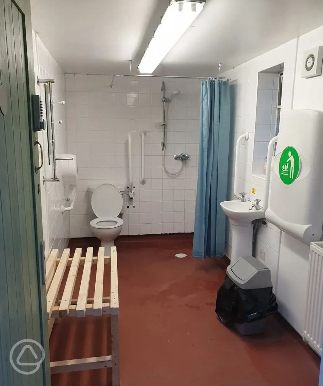 Accessible facilities with grab rails, bench, shower, and baby changing