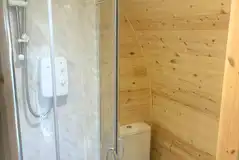 Luxury pod ensuite with a toilet, hand basin and shower Luxury pod ensuite with a toilet, hand basin and shower