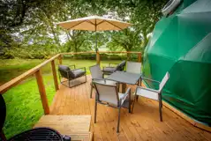 Glamping domes outside seating Glamping domes outside seating