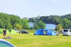 Non electric grass pitches set near the Great Lake with views to Castle Howard