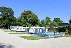 Hardstanding touring pitches with 10 amp hook ups and adjacent grass areas