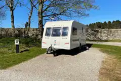 Hardstanding touring pitches with 10 amp hook ups and adjacent grass areas