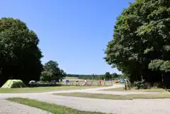 Hardstanding touring pitches with 10 amp hook ups and adjacent grass areas