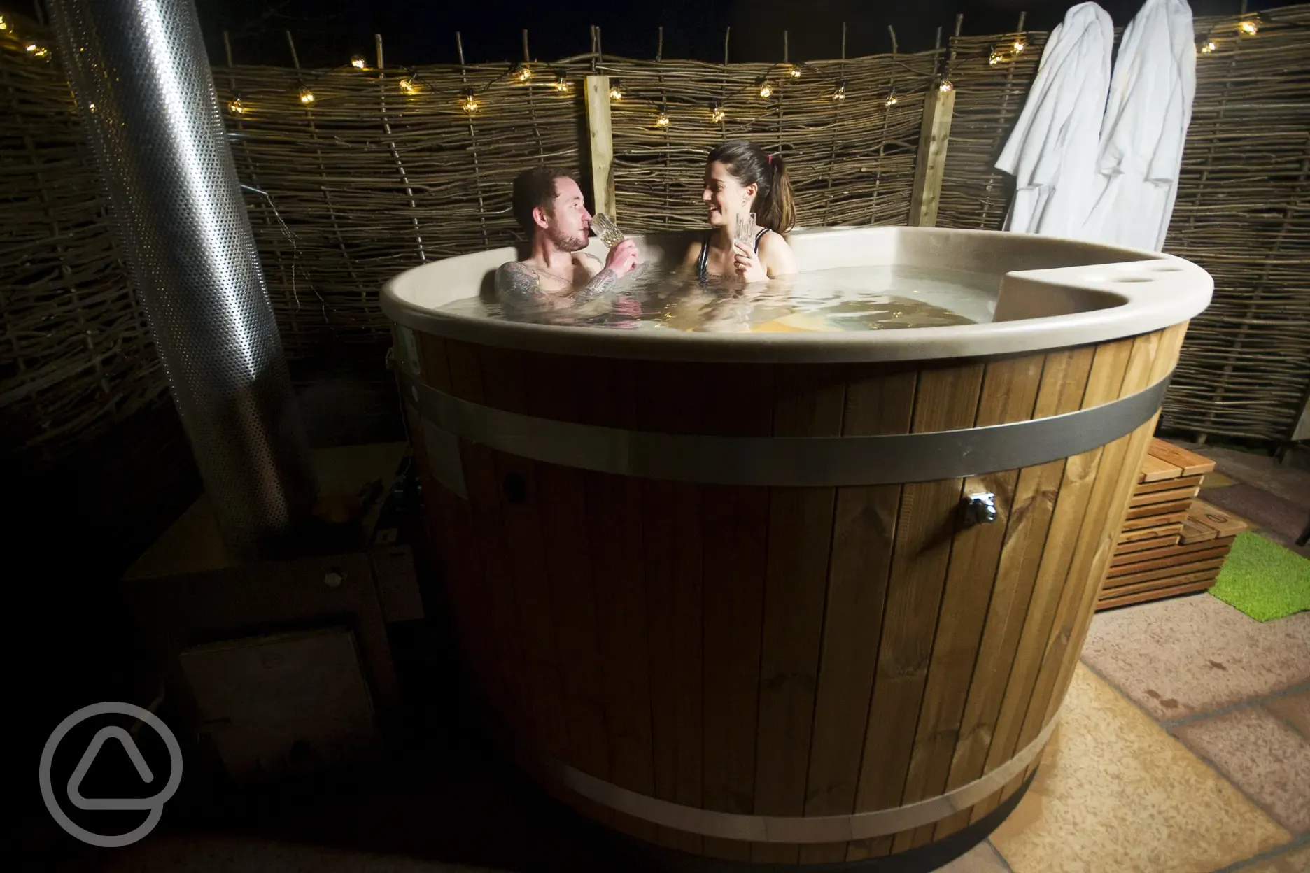 Optional four person hot tub at night