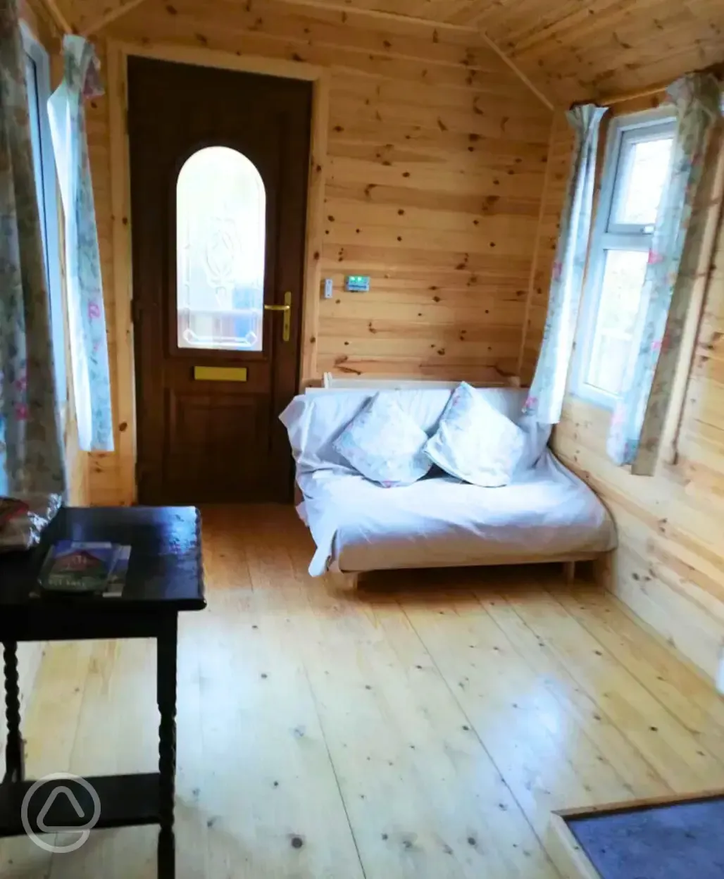 Millie glamping cabin interior and futon bed