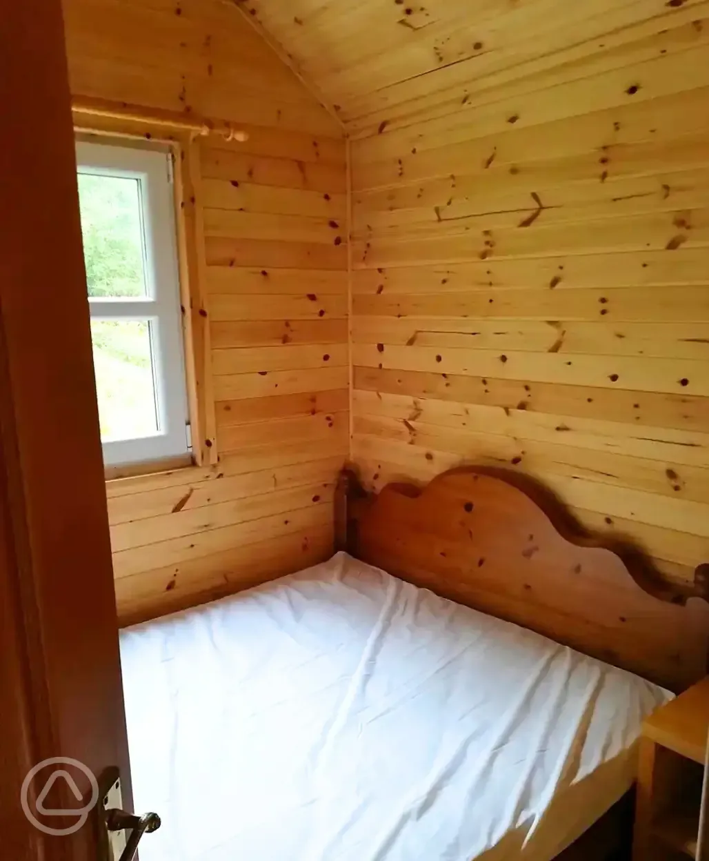 Large glamping cabin double bed