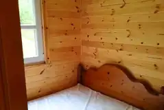 Large glamping cabin double bed