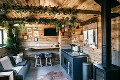 Potting Barn sofa and kitchen area with microwave/oven, sink and hob