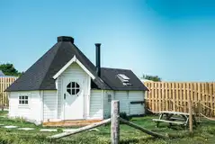 Mawgies glamping cabin with a garden area and hot tub