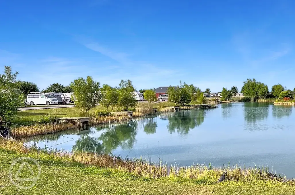 Electric grass tent and touring pitches with lakeside views