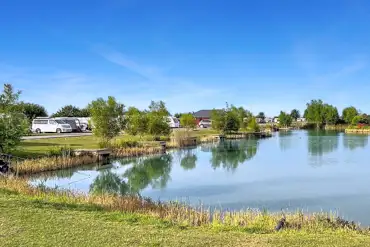Electric grass tent and touring pitches with lakeside views
