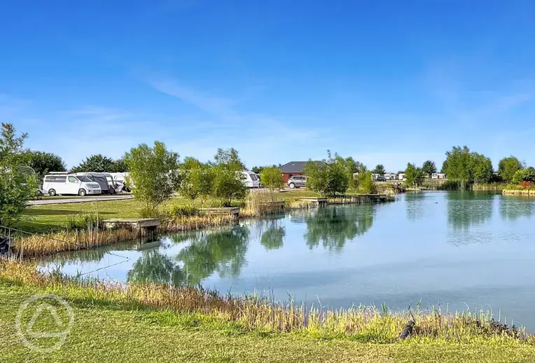 Electric grass tent and touring pitches with lakeside views