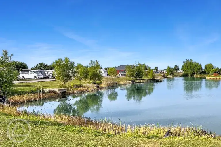 Electric grass tent and touring pitches with lakeside views