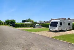 Electric grass and gravel hardstanding pitches with 16 amp hook up Electric grass and gravel hardstanding pitches with 16 amp hook up