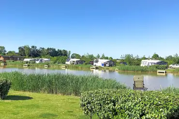 Fully serviced hardstanding pitches and onsite fishing lake at The Laurels