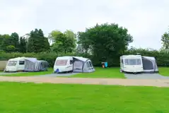 Electric hardstanding and grass touring pitches Electric hardstanding and grass touring pitches