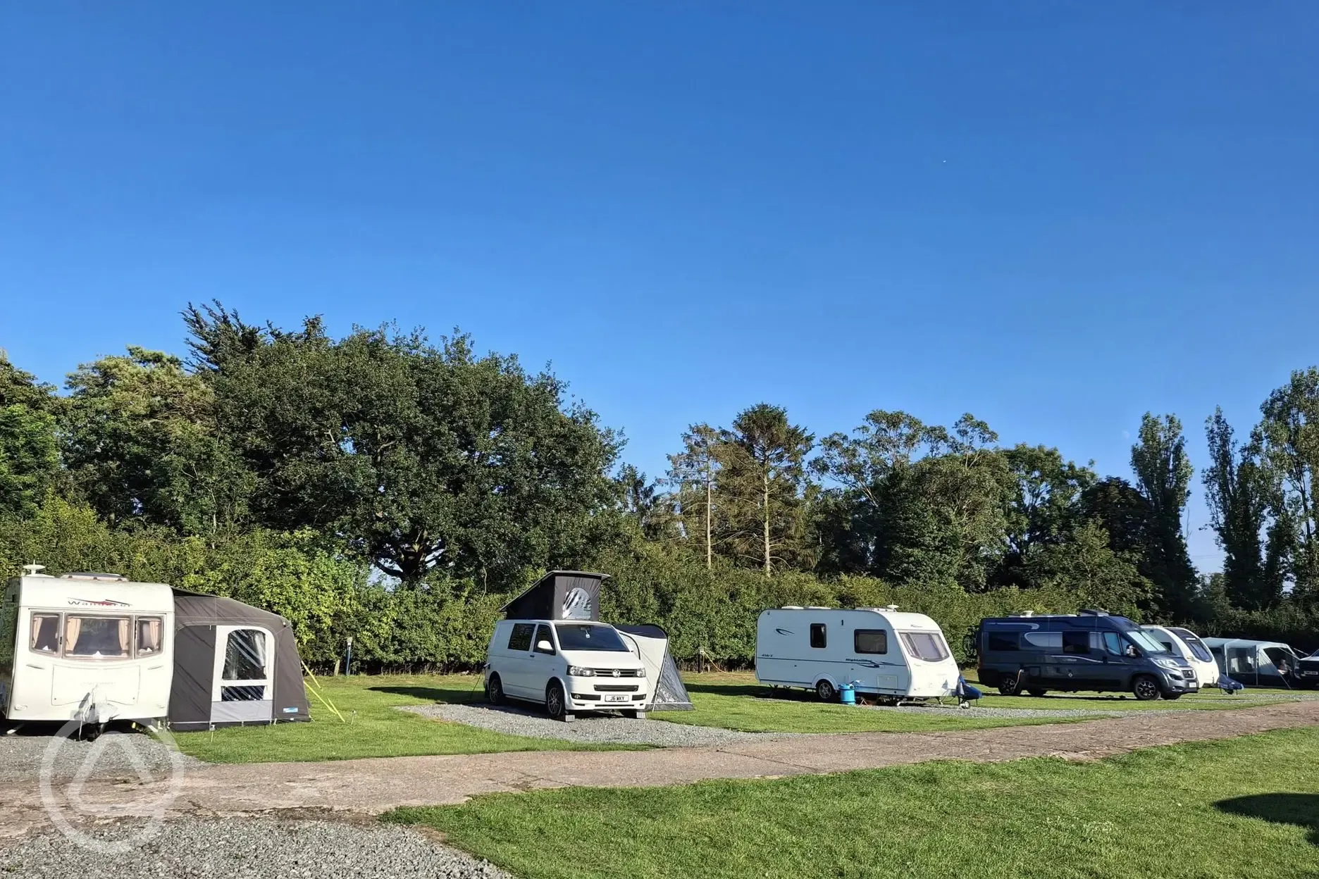 Electric hardstanding and grass touring pitches