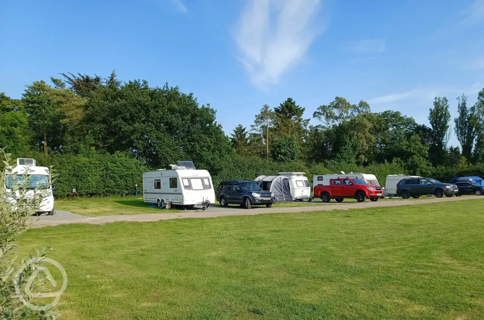 Electric hardstanding and grass touring pitches