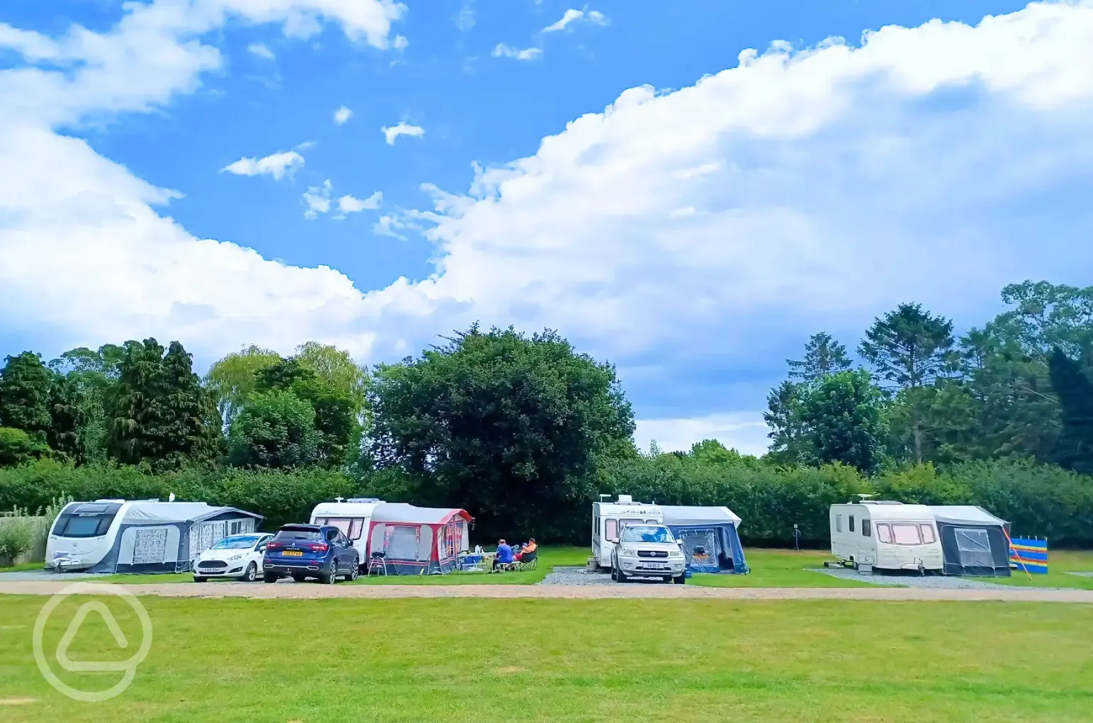 Electric hardstanding and grass touring pitches