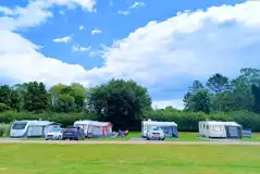 Electric hardstanding and grass touring pitches Electric hardstanding and grass touring pitches