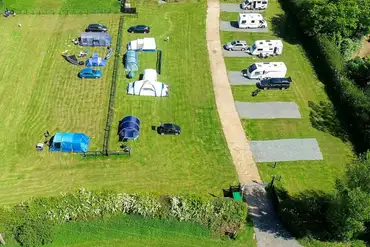 Aerial of the campsite with grass and hardstanding pitches