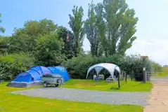 Winter electric hardstanding and grass touring pitches Winter electric hardstanding and grass touring pitches