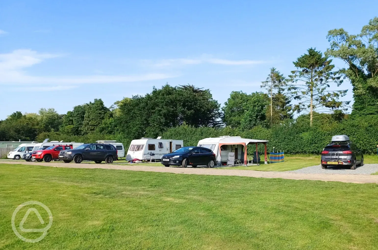 Electric hardstanding and grass touring pitches